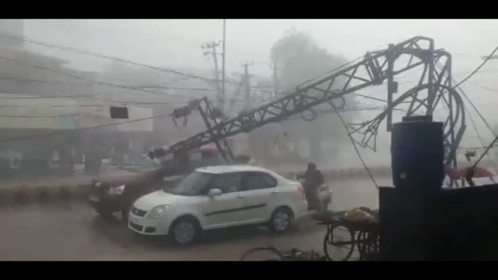 An electric pole fell on a car