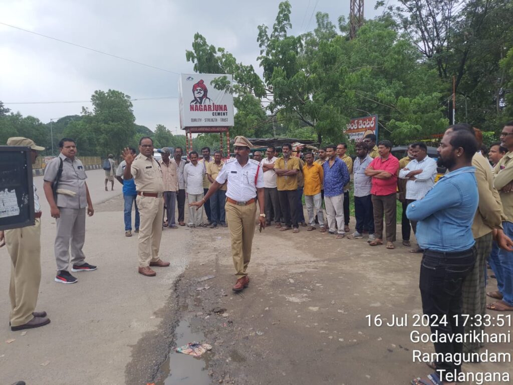 ACP Johnny Narsimhulu and Traffic CI Rajendra Prasad's staff at the square of the bus stand