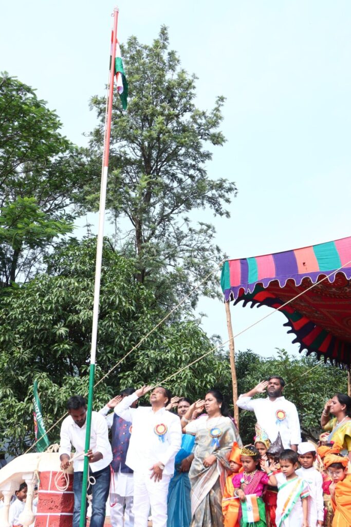 Dr. A. Chandrasekhar, former minister, unveiled the national flag