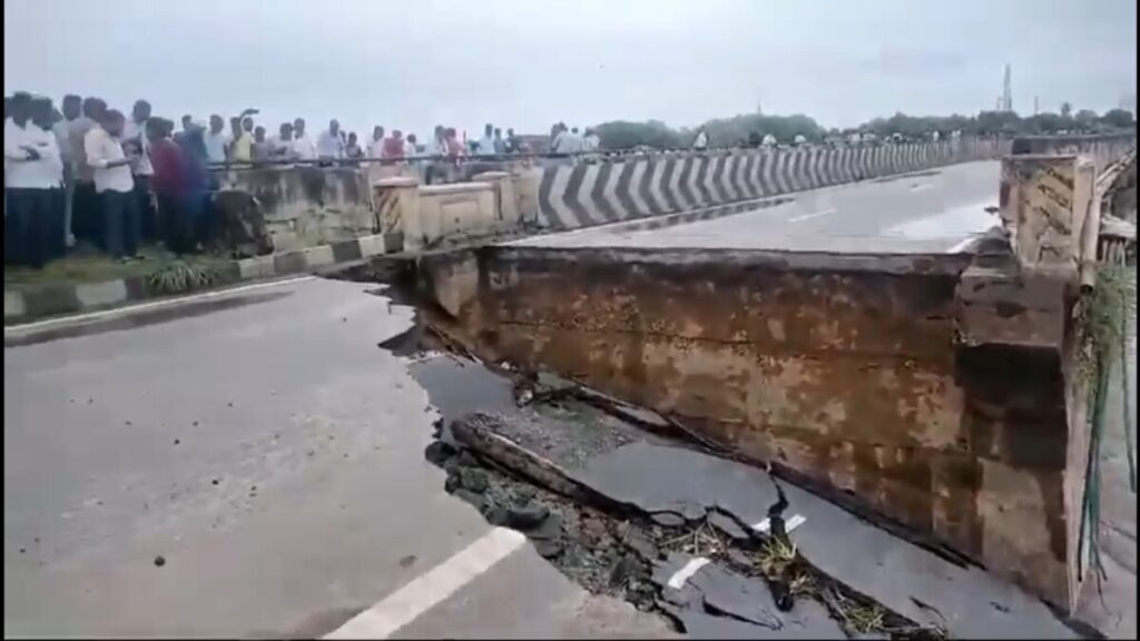 The Vijayawada-Hyderabad national highway was washed away by the flood surge at Garikapadu