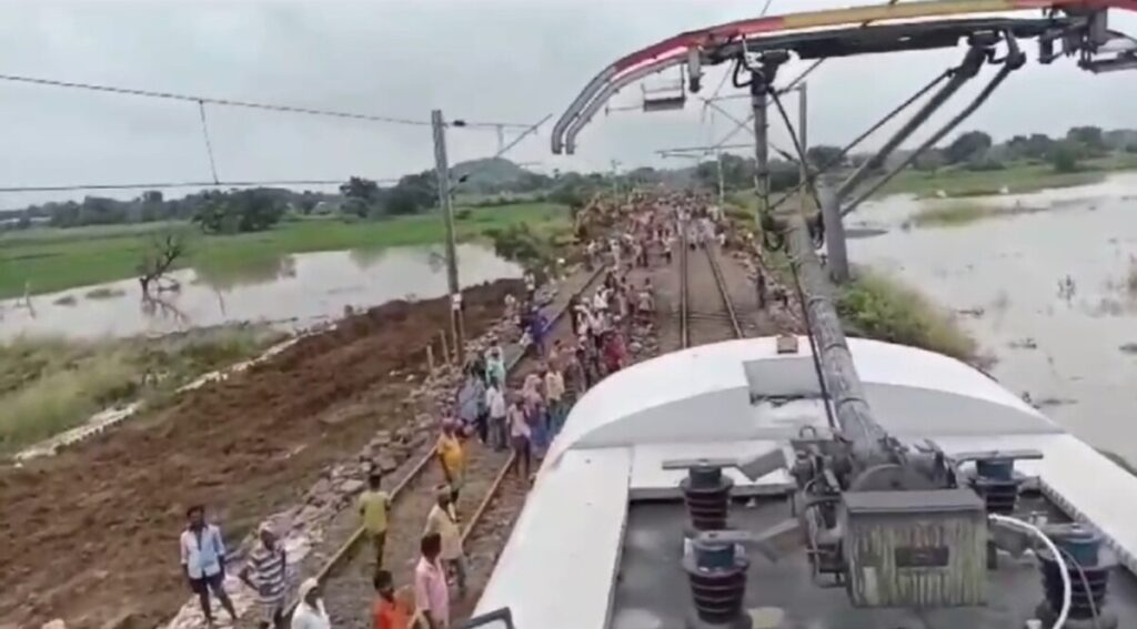 Officials conducting a trial run on the track