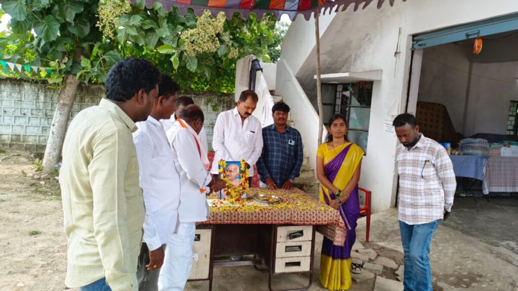 Lavanya pays tribute to the portrait of Gandhi on the occasion of his birth anniversary in Ramagiri mandal