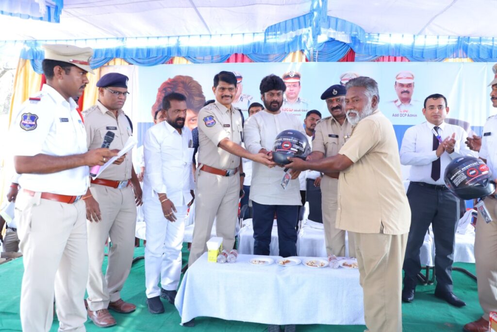 Traffic Police distributes helmets