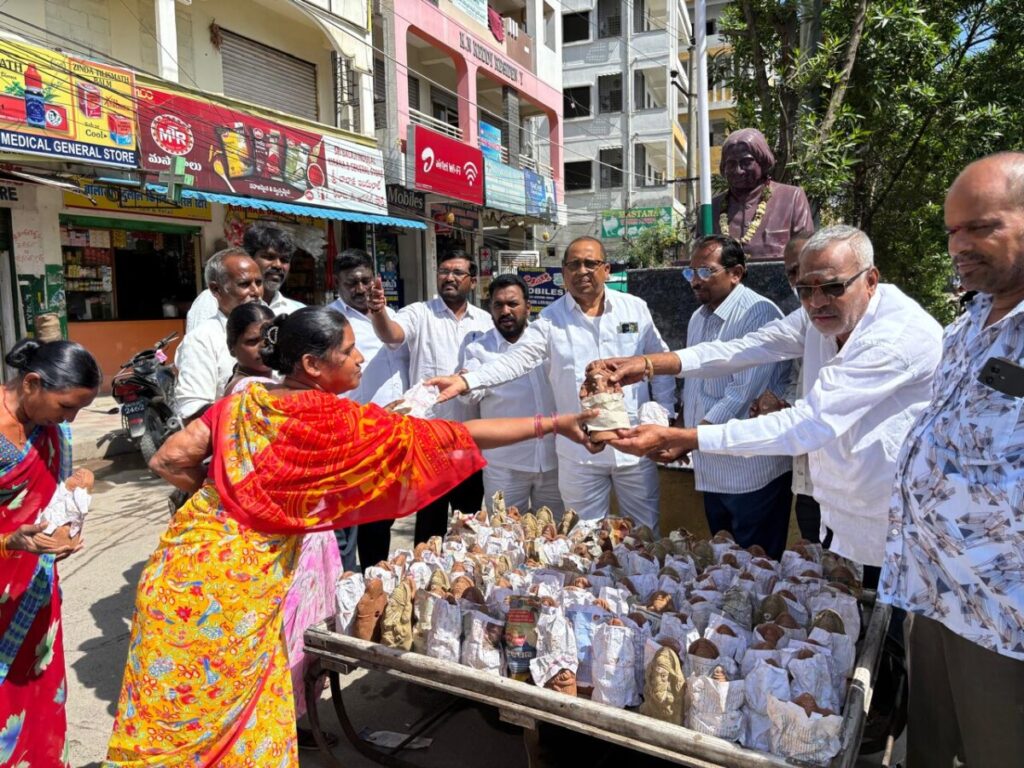 Corporator distributes clay Vinayaka idols
