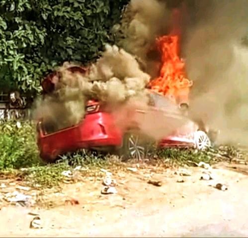 A car that hit a bike and a tanker 