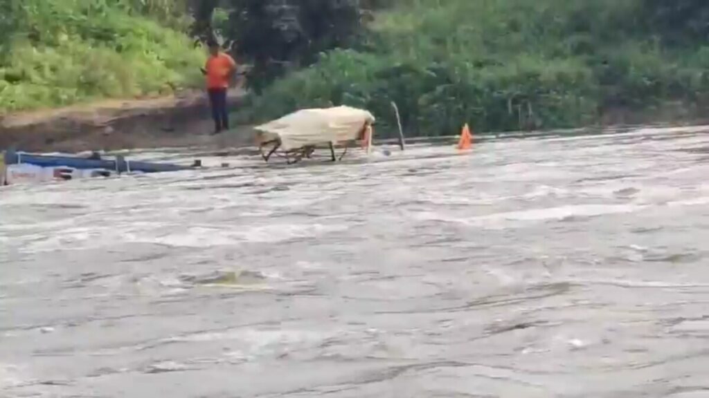 Tractor washed away in flood