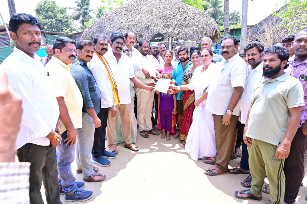 MLA Bathula hands over a cheque